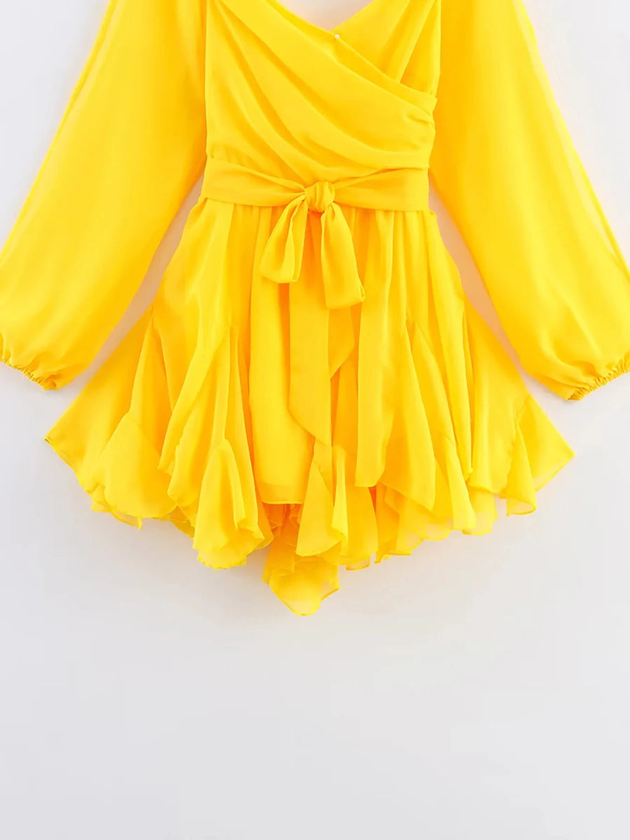 Yellow dress with long sleeves on a white background