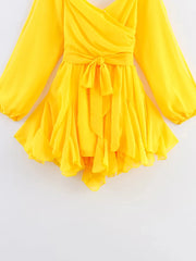 Yellow dress with long sleeves on a white background