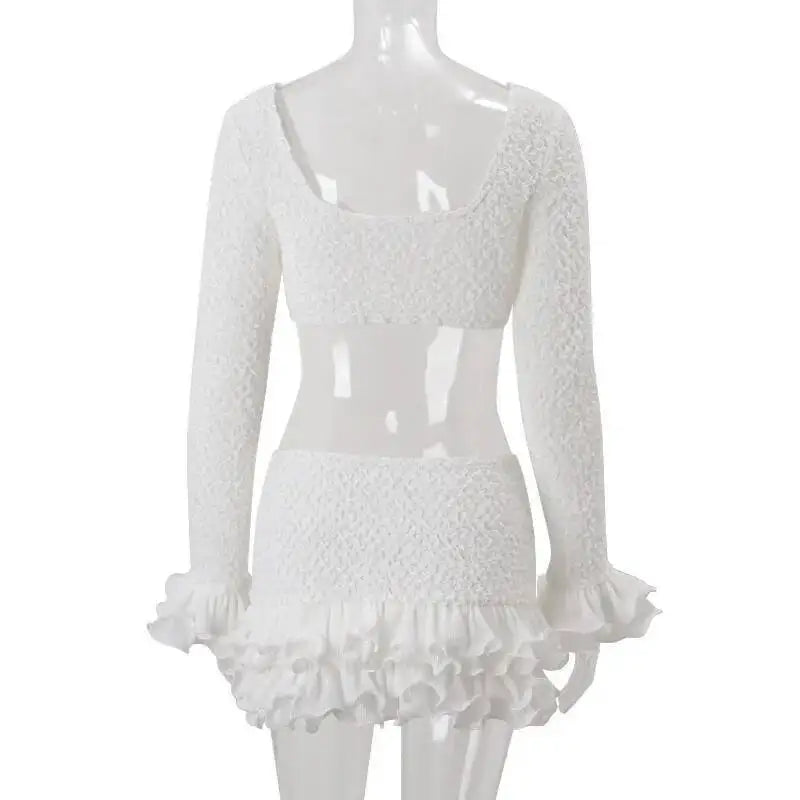 White lace dress on a mannequin against a white background