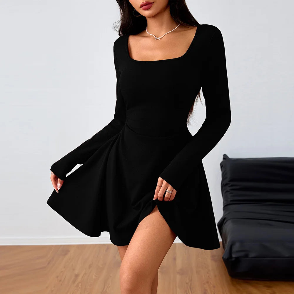 Black long-sleeve dress worn by a model
