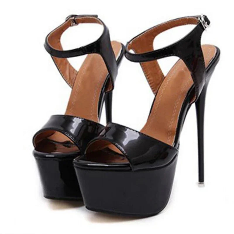 Black high-heeled platform sandals on a white background