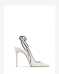 White high-heeled shoe with a clear strap on a white background