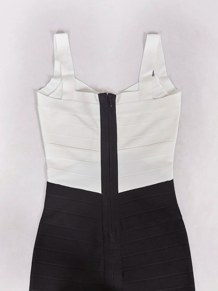 Black and white dress with a zipper on a light gray background