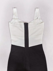 Black and white dress with a zipper on a light gray background