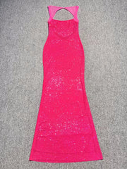 Pink dress with cutout back on a gray surface