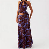 Woman wearing a floral two-piece dress set on a white background