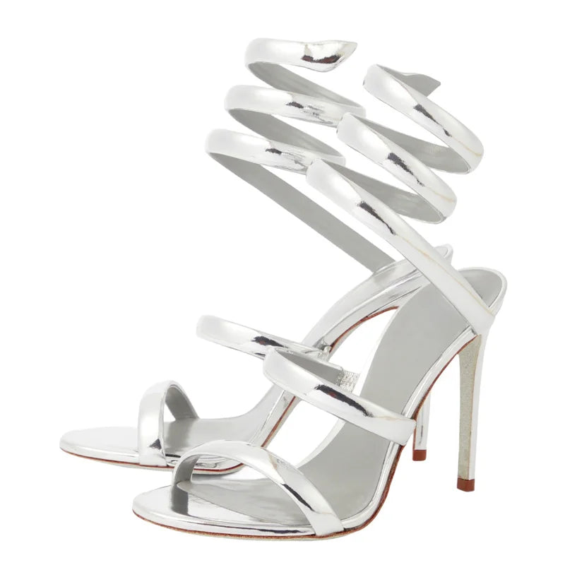 Silver high-heeled sandals with spiral design on a white background