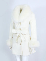 White coat with fur trim on a mannequin against a light gray background