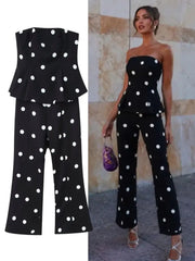 Black polka dot strapless peplum top and high-waisted flare pants set