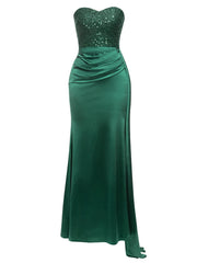 Green strapless evening gown with sequined top on a white background