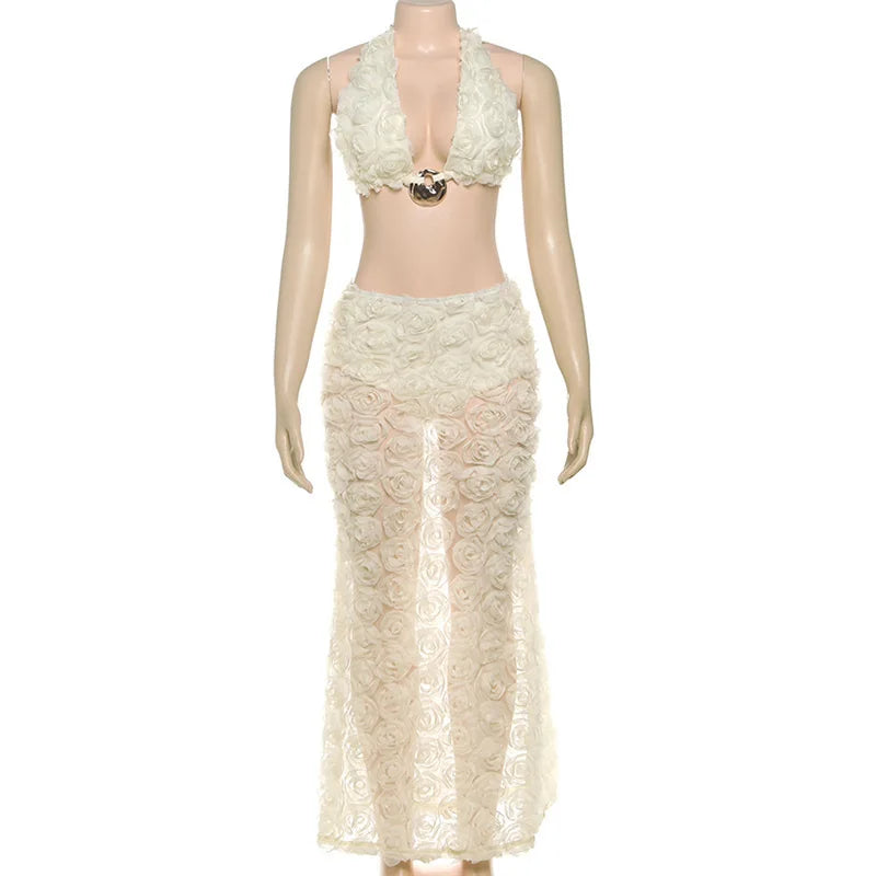 Mannequin wearing a cream lace halter top and skirt set on a white background
