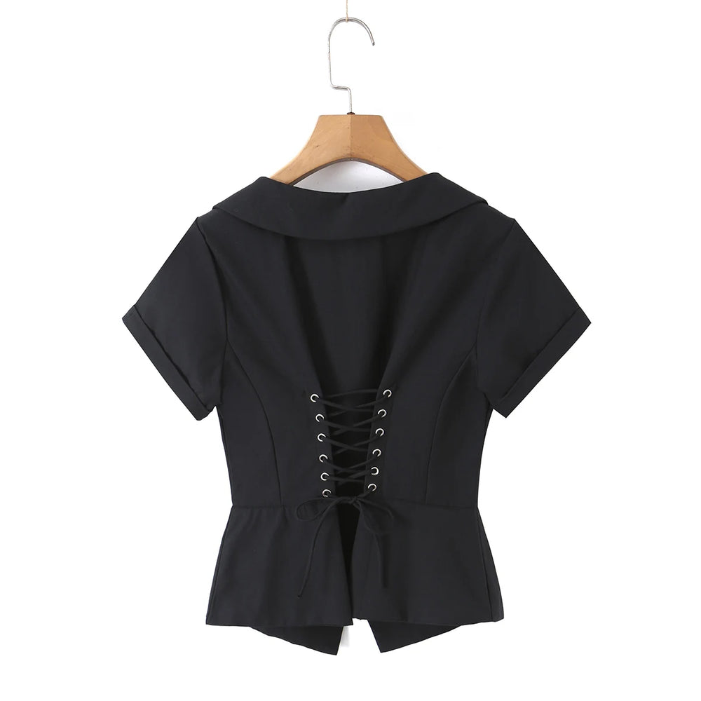 White lapel collar corset top displayed on a hanger