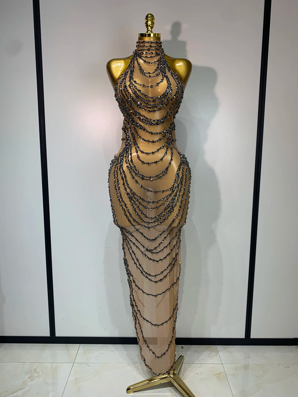 Chain embellished halter gown with sheer overlay