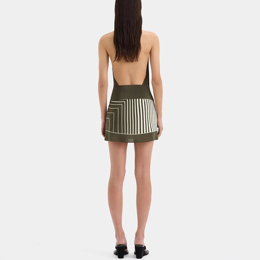 Back view of a stripe halter neck mini dress