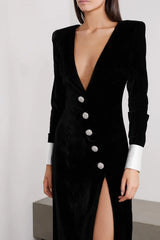 Black velvet dress with silver buttons and a high slit
