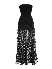 Black strapless dress with a patterned skirt on a white background