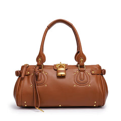 Brown studded lock top handle bag