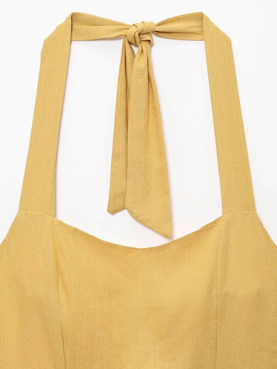 Yellow apron with a tied neck strap on a white background
