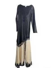 Long dress with black top and beige bottom on a white background