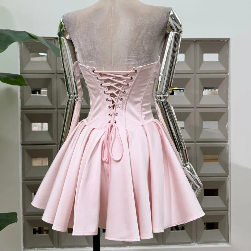 Pink strapless corset fit and flare dress back view