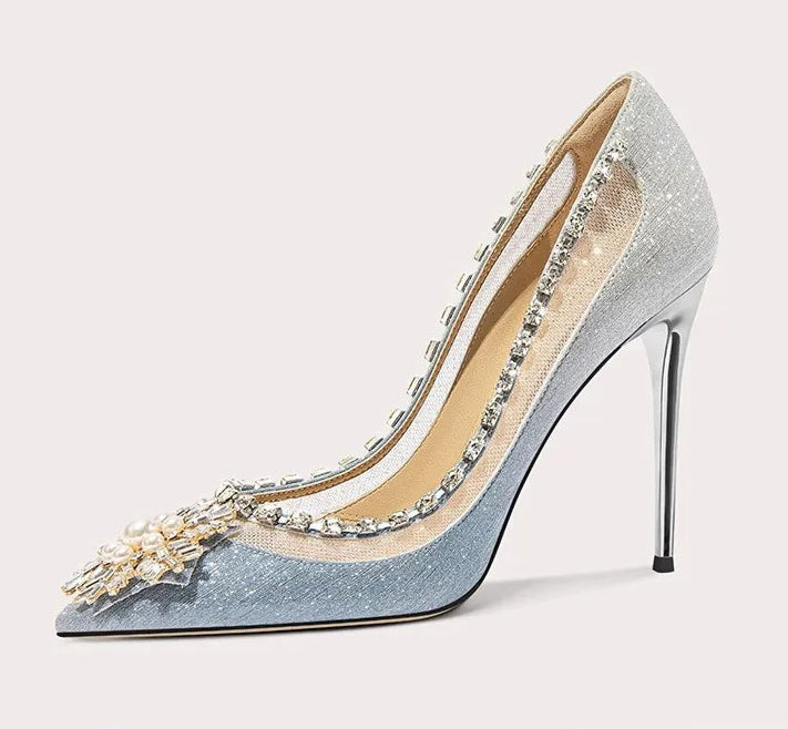 High-heeled shoe with decorative elements on a light gray background