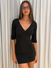 Black three-quarter sleeve v-neck ruched bodycon mini dress