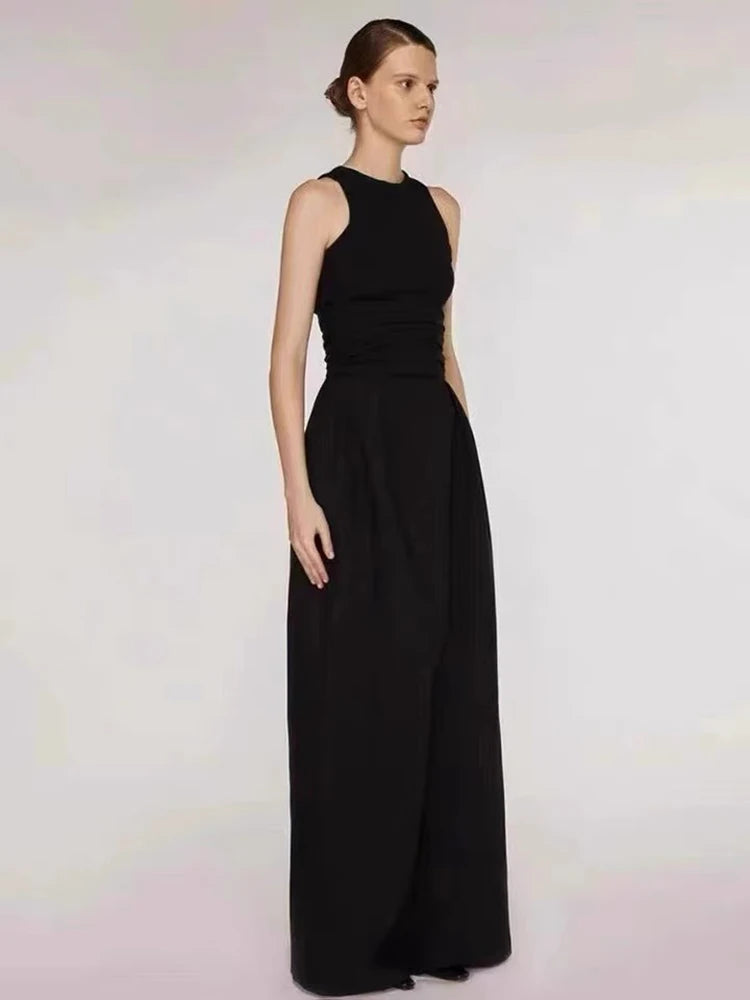 Woman wearing a black sleeveless gown