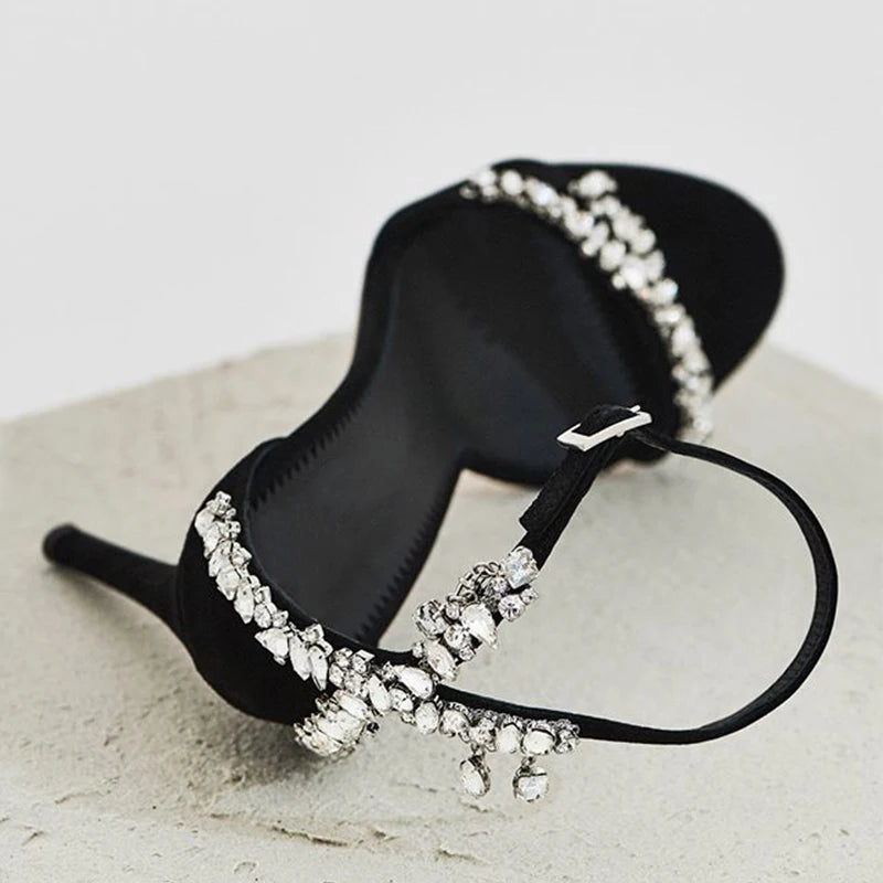 Close-up of embellished ankle strap stiletto heel