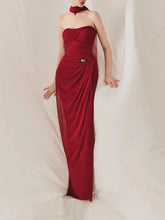 Red draped strapless maxi dress with metal buckle accent