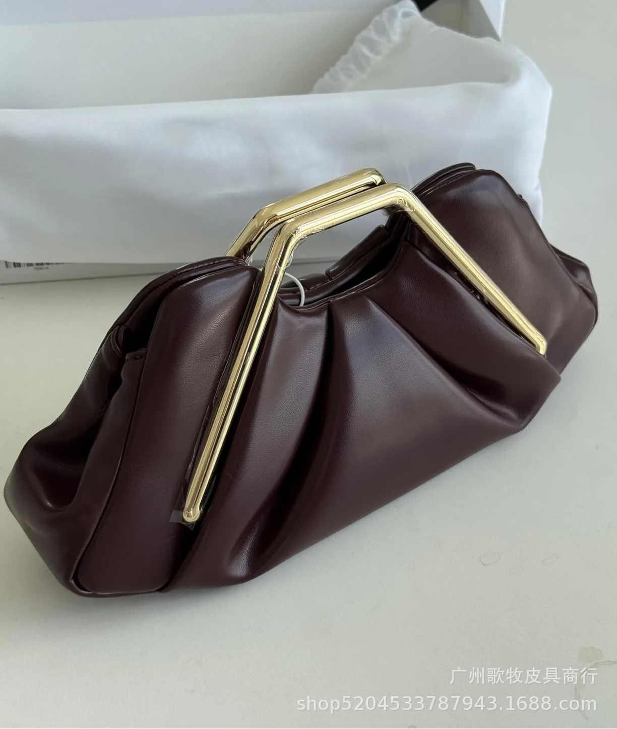 Brown handbag with gold handle
