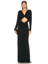 Black evening gown with cut-out design on a white background