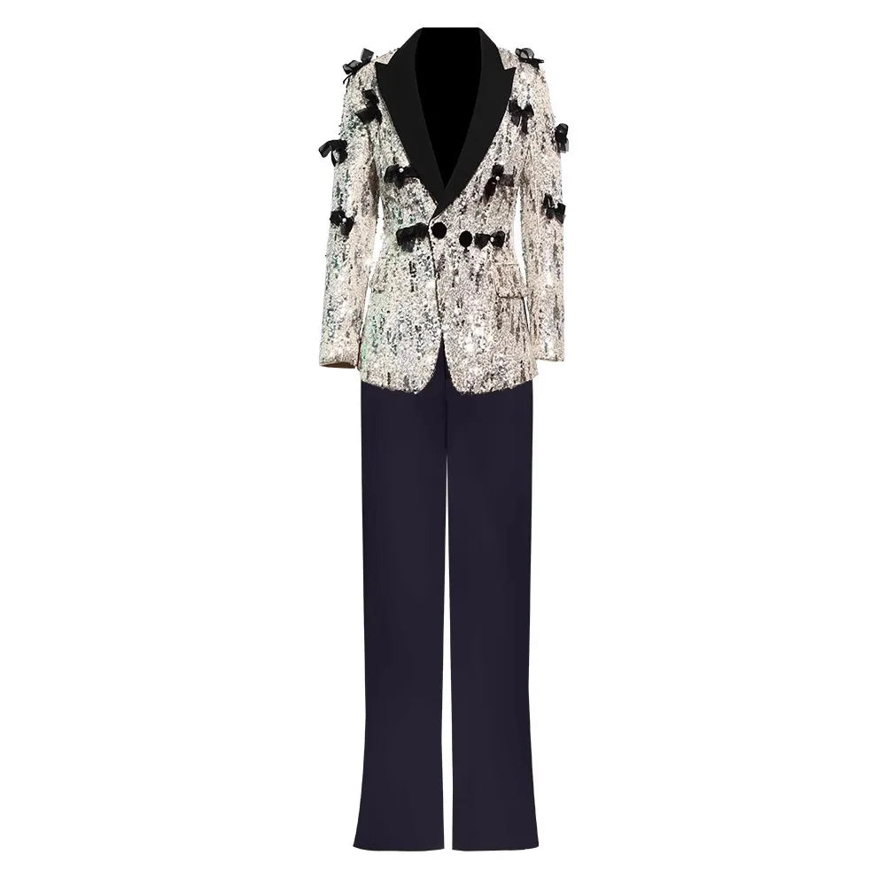 Sequined blazer with black lapels and matching pants on a white background