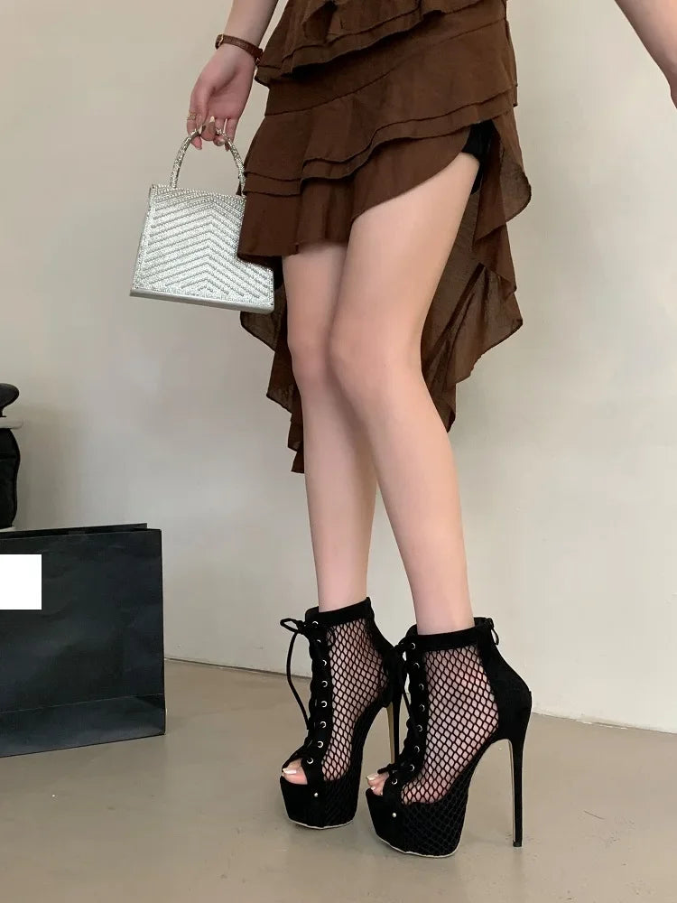Person wearing a brown ruffled skirt and black platform heels, holding a white handbag.