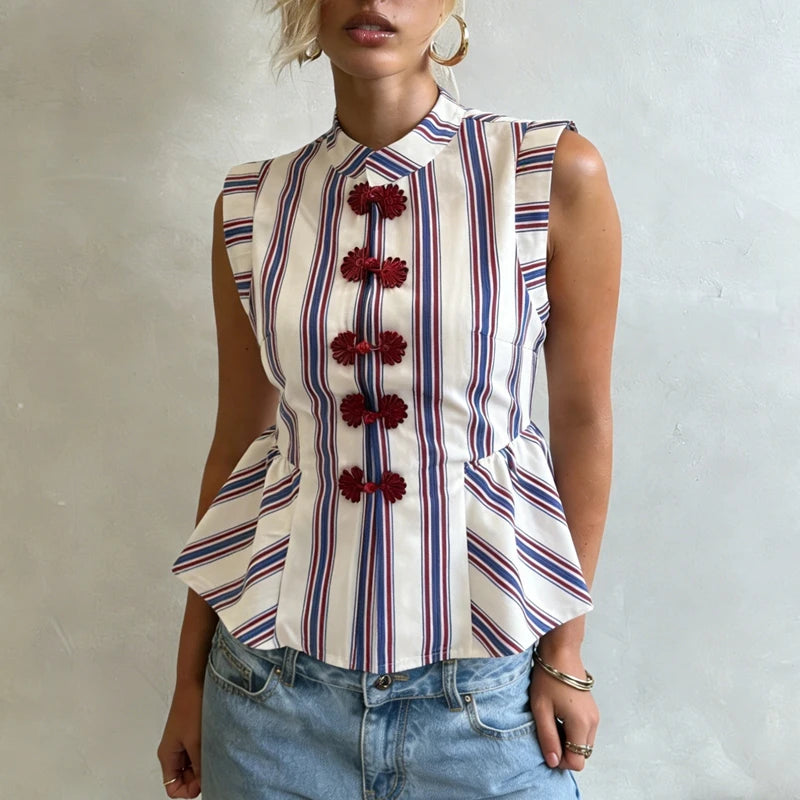 Close-up of the striped peplum top's knot button detail