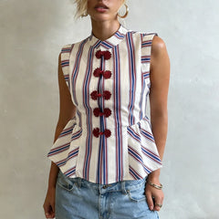 Close-up of the striped peplum top's knot button detail