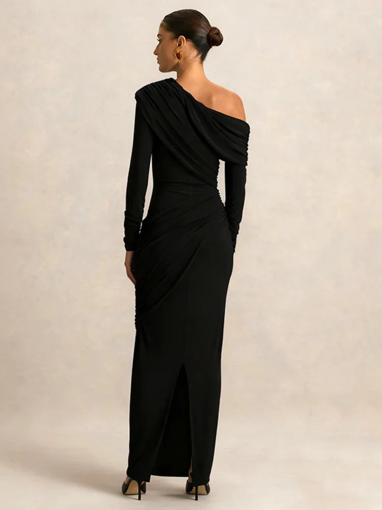 Black one-shoulder evening gown on a plain background