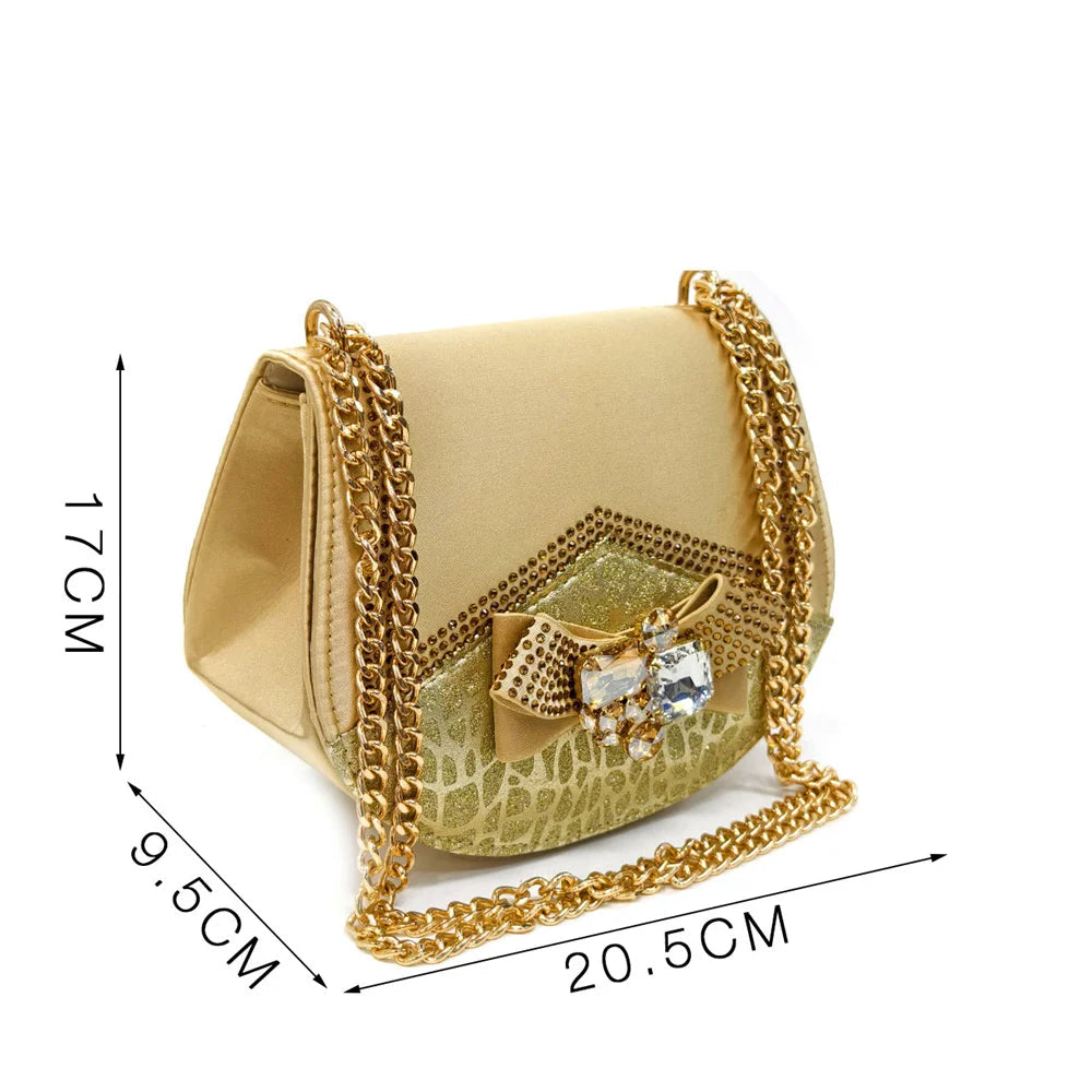 Gold handbag with chain strap and measurements on a white background