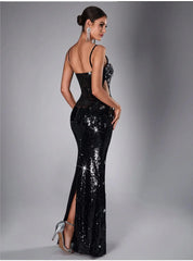 Back view of a black sequin evening dress with spaghetti straps