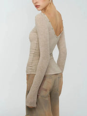Back view of ruched boat neck long sleeve top