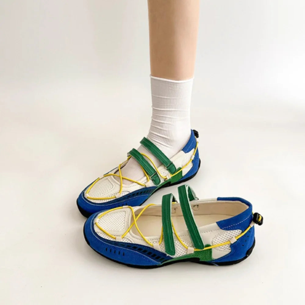 Yellow and black mesh Mary Jane shoes with hook and loop straps.