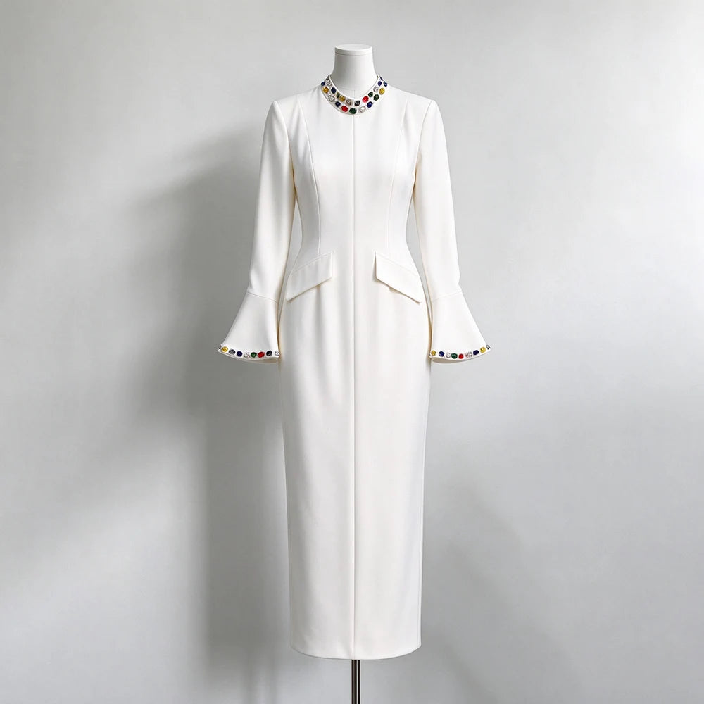 White formal evening dress with crystal embellished neckline and flared sleeves on mannequin