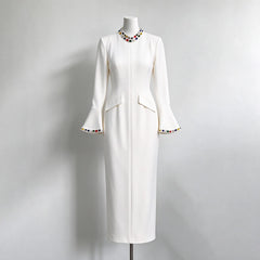 White formal evening dress with crystal embellished neckline and flared sleeves on mannequin