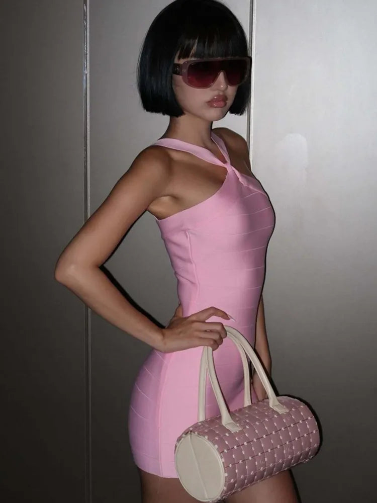 Close-up of pink mini bandage dress with halter neckline