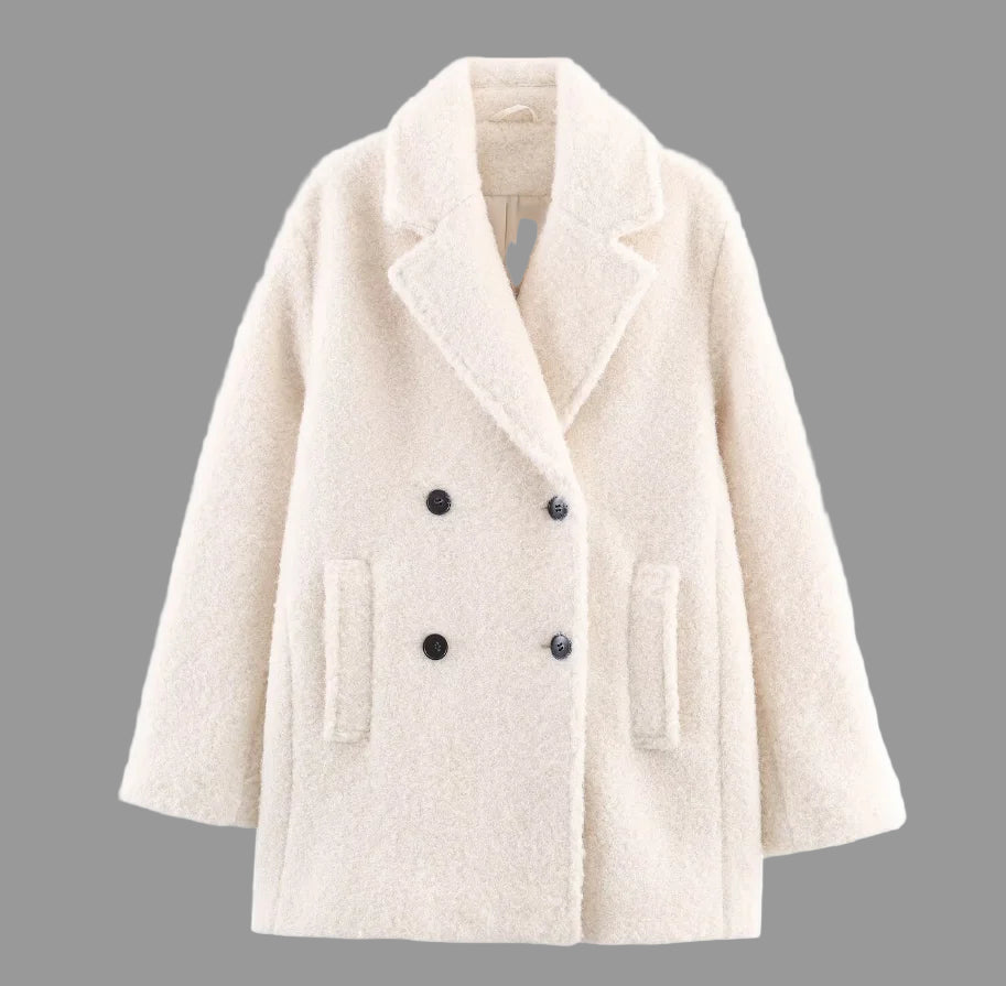 Beige coat with black buttons on a white background