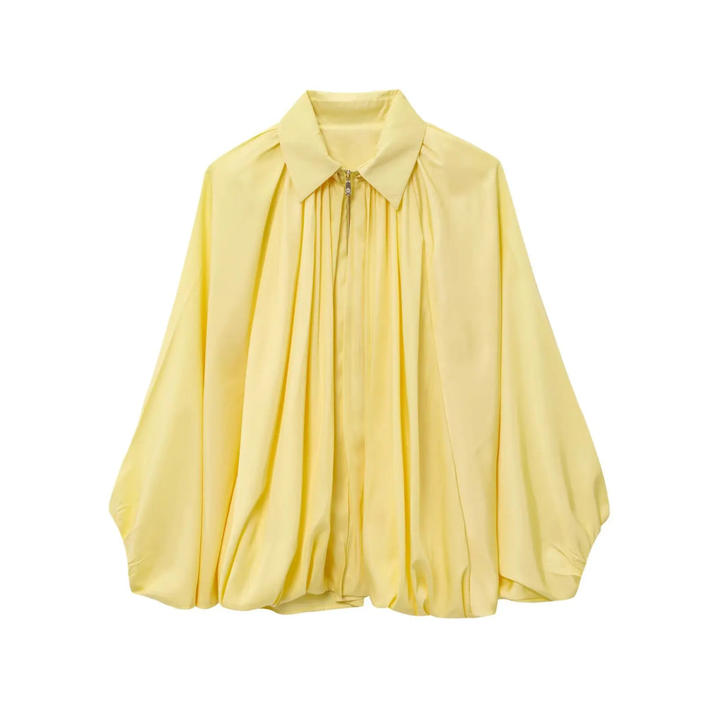 Yellow blouse on a white background