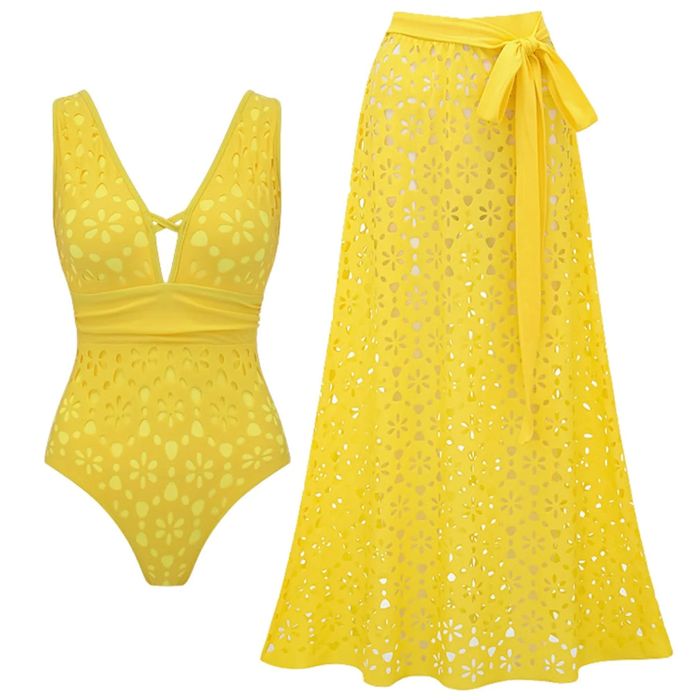 Yellow eyelet one-piece swimsuit with a V-neck and criss-cross detail, alongside a matching yellow eyelet maxi skirt with a tie waist.
