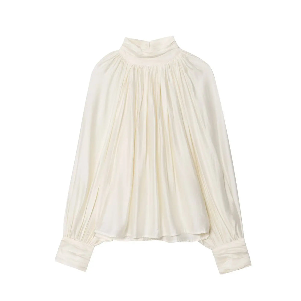 White blouse with pleated design on a white background
