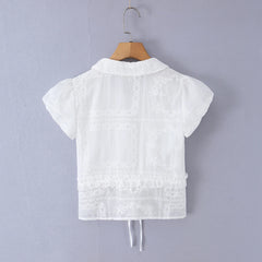 Back view of white embroidered puff sleeve crop top