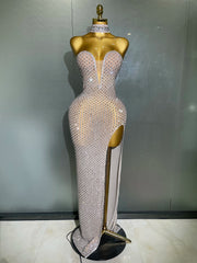 Sparkling evening gown on a mannequin against a plain background
