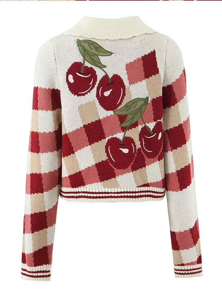 Checkered sweater with cherry design on a white background